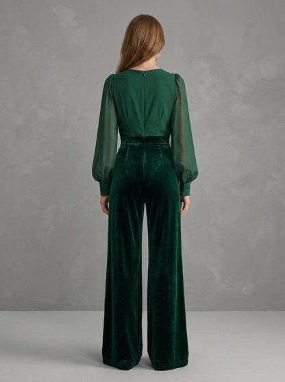 Bernadette — tuta verde bosco con maniche trasparenti e pantalone in velluto, vista posteriore